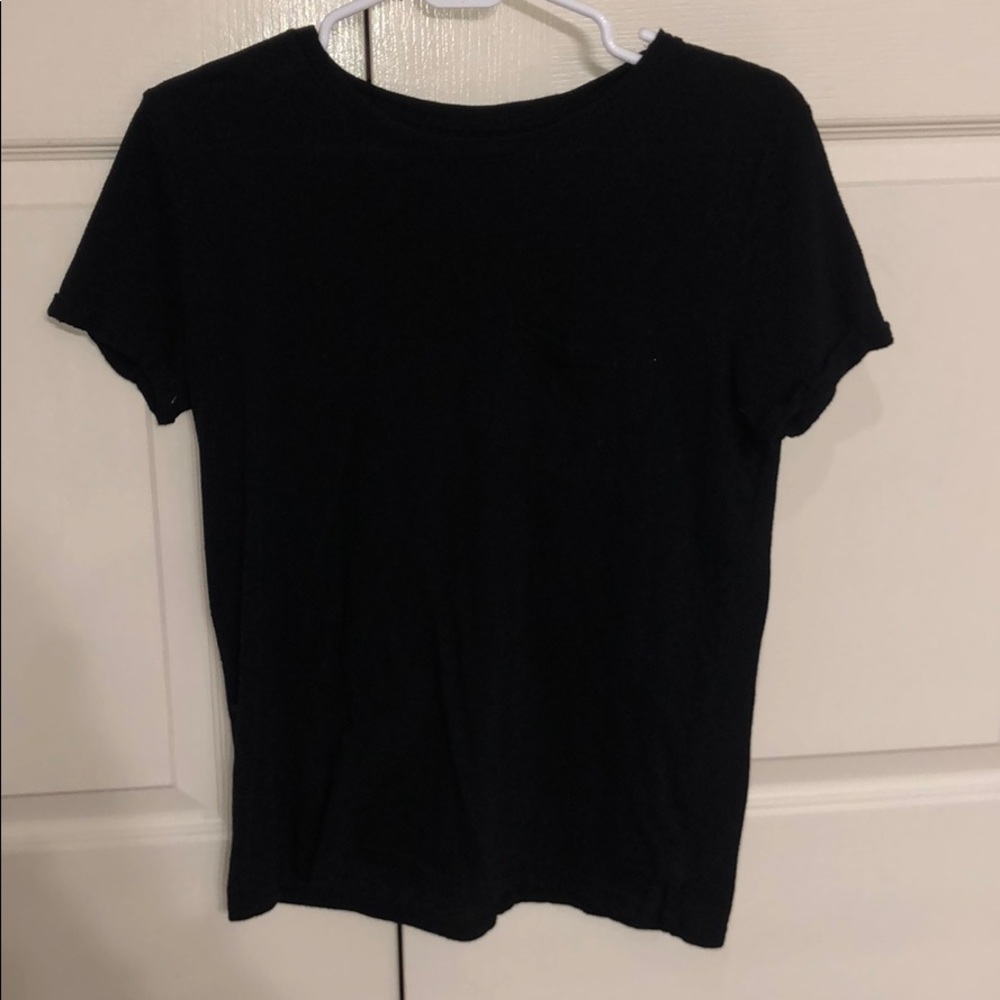 Plain black t-shirt. With frocket